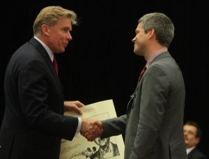 Rowswell receiving the Palmer Prize for Diplomats from the Lithuanian Foreign Minister.