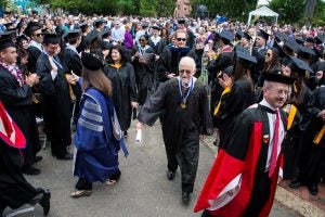 Crowd and procession at college graduation