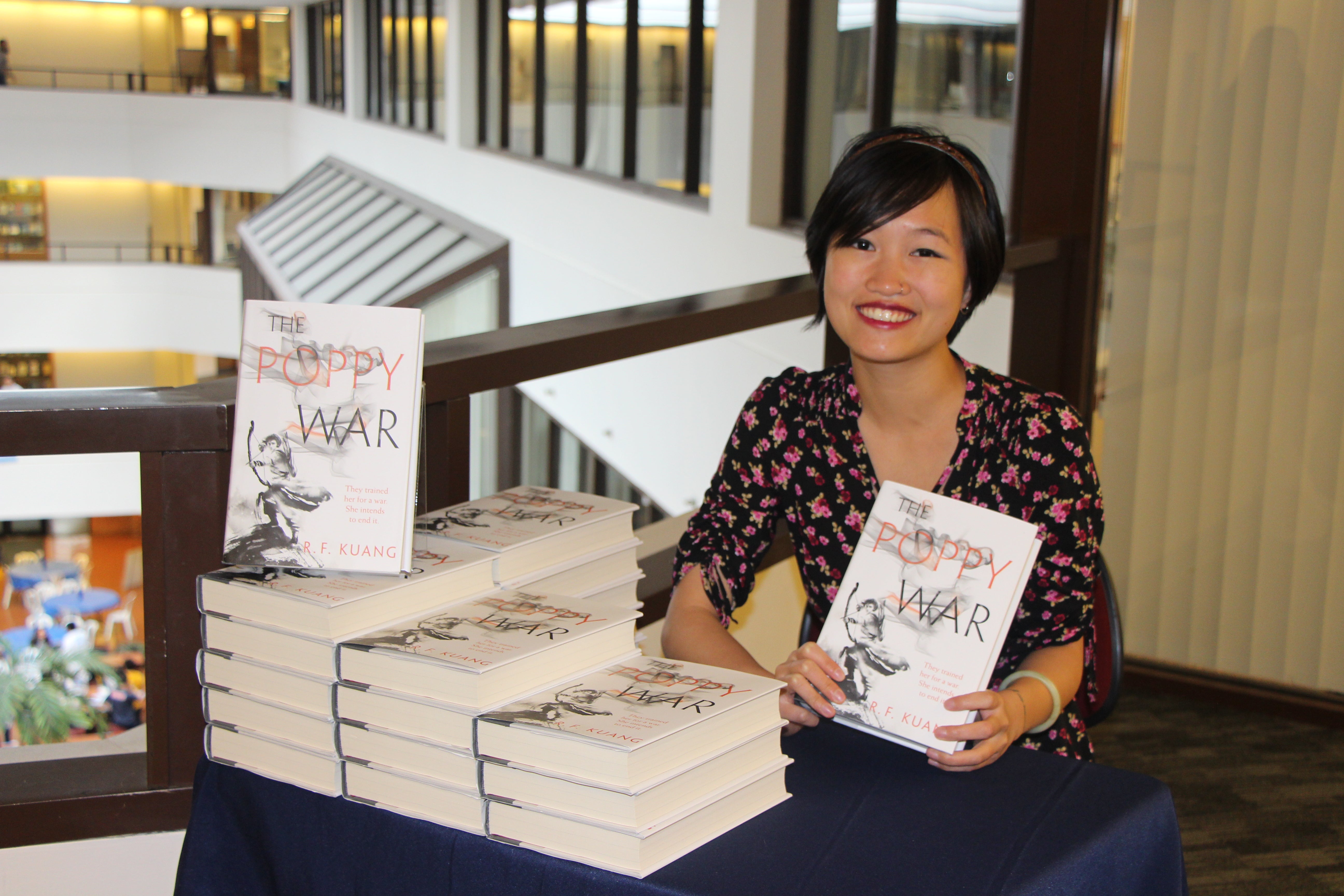 Kuang with her published books in the ICC 