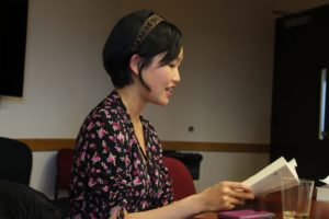 Kuang reading her published book to an audience 