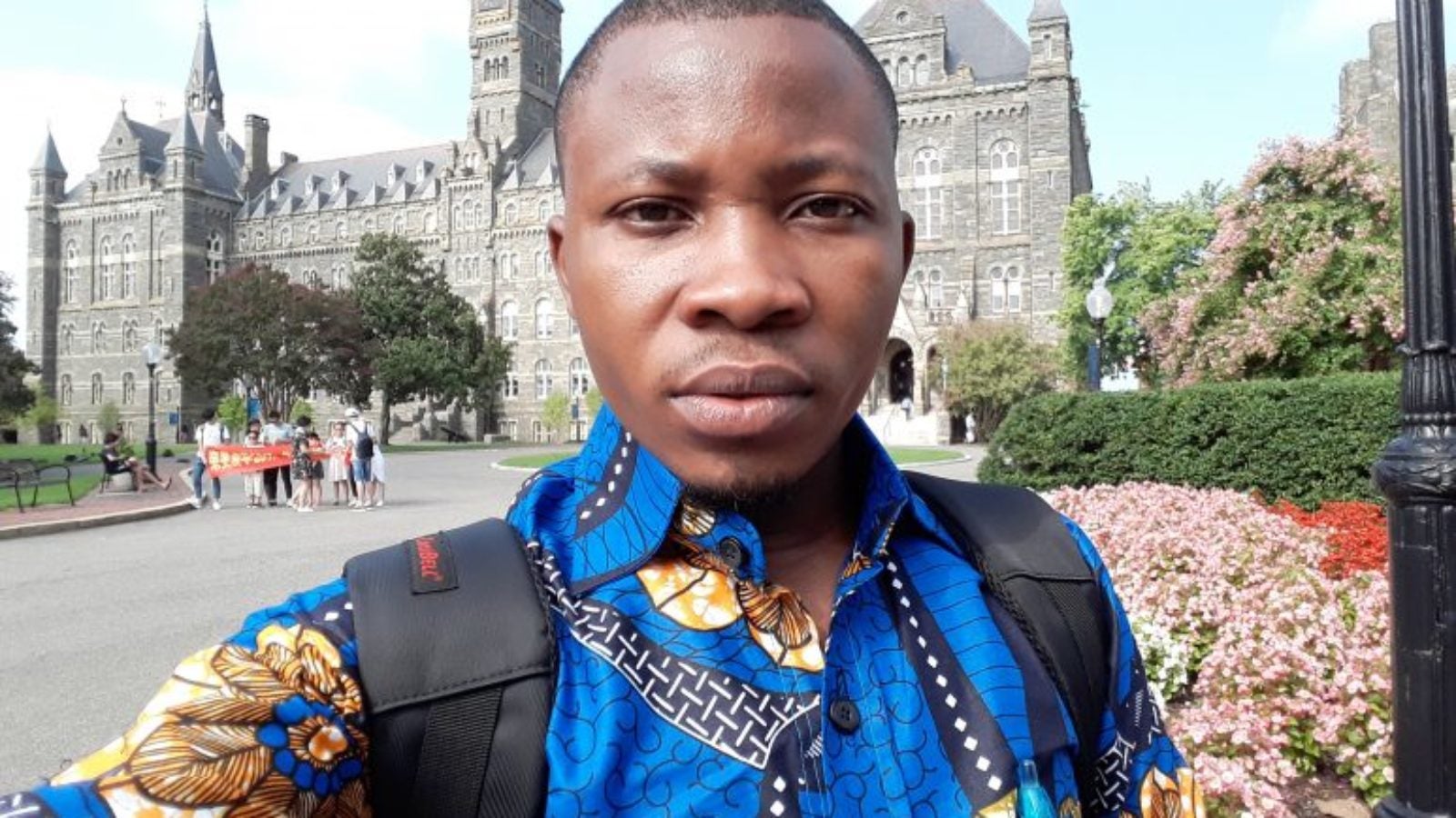 Muzabel Welongo stands in front of Healy Hall