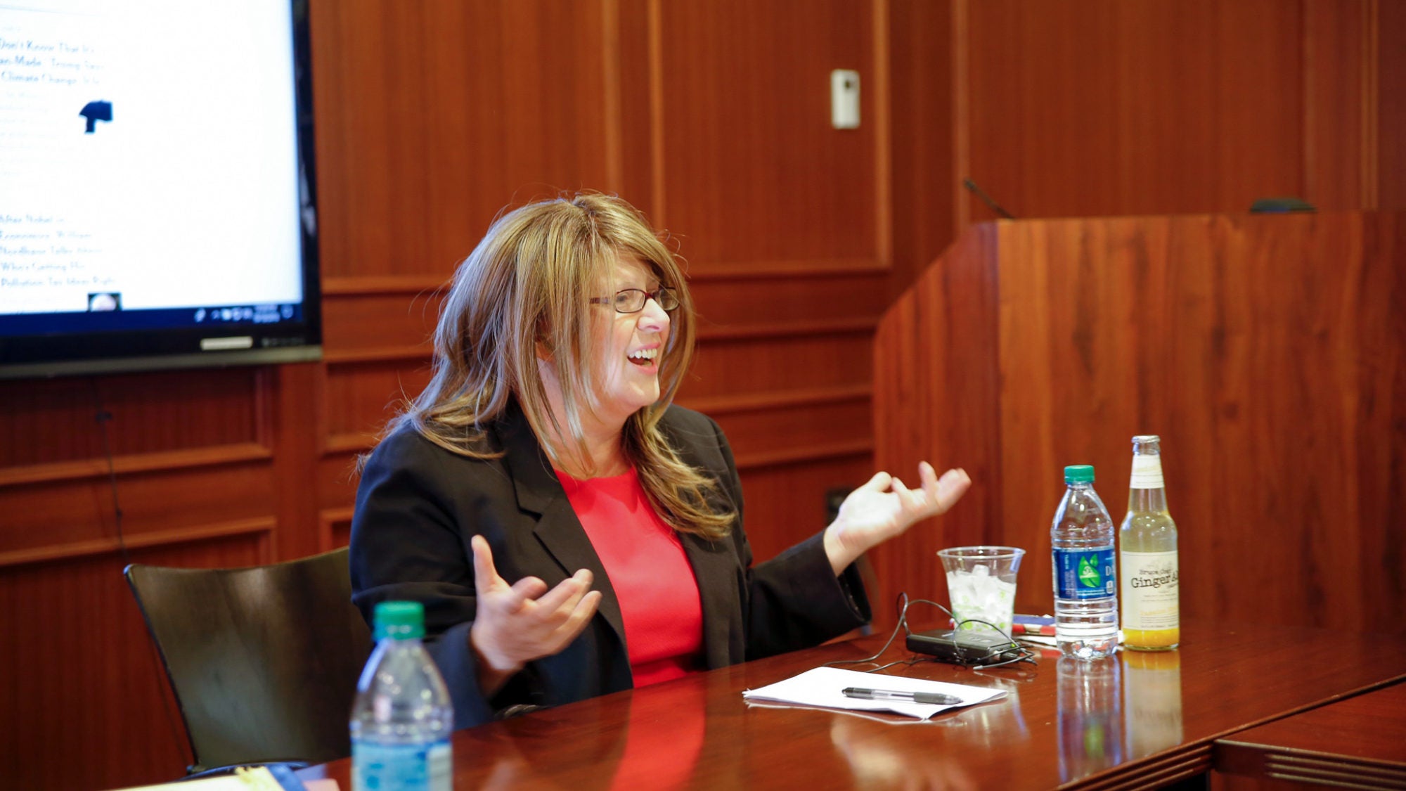 Friedman at desk speaking at Mortara center.