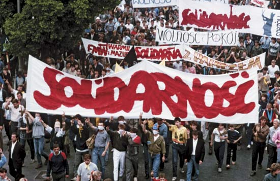 Protesters in Poland holding a banner.