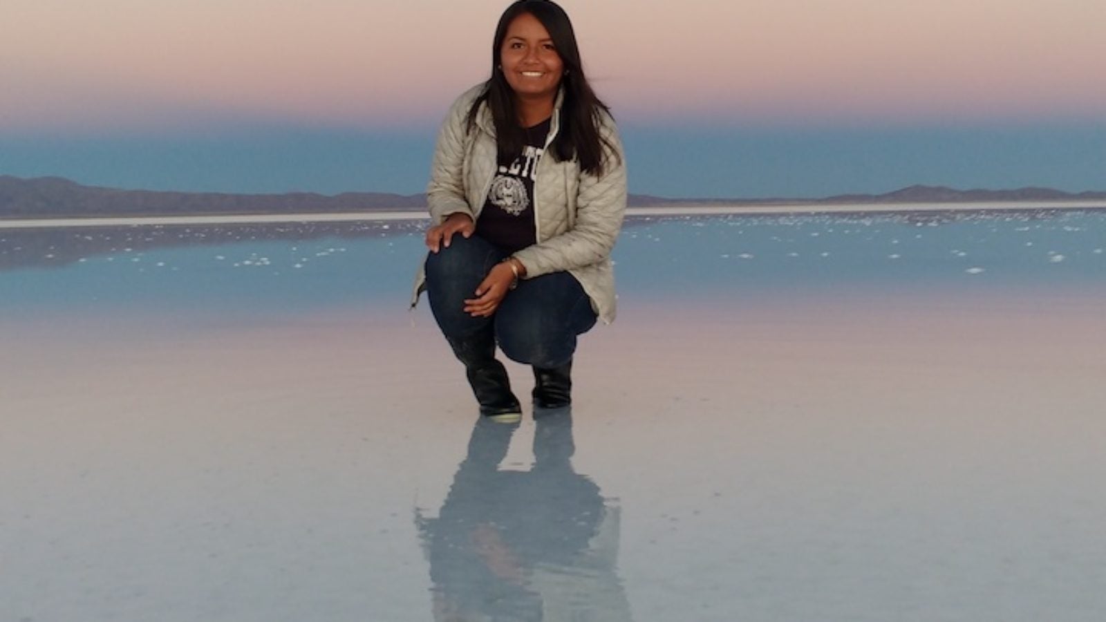 Georgetown Grad student in Bolivia at the reflecting salt lake
