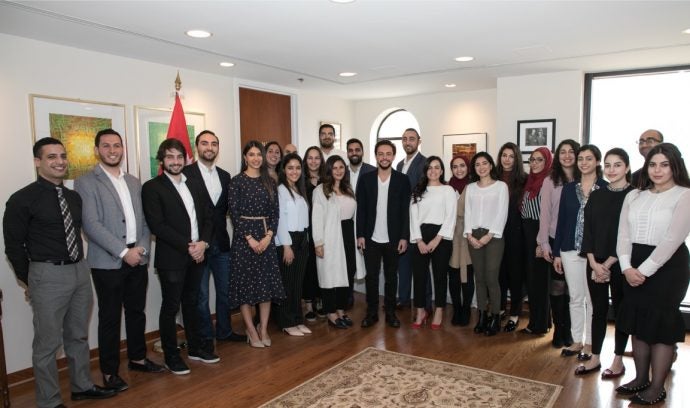 Large group of people pose for photo.