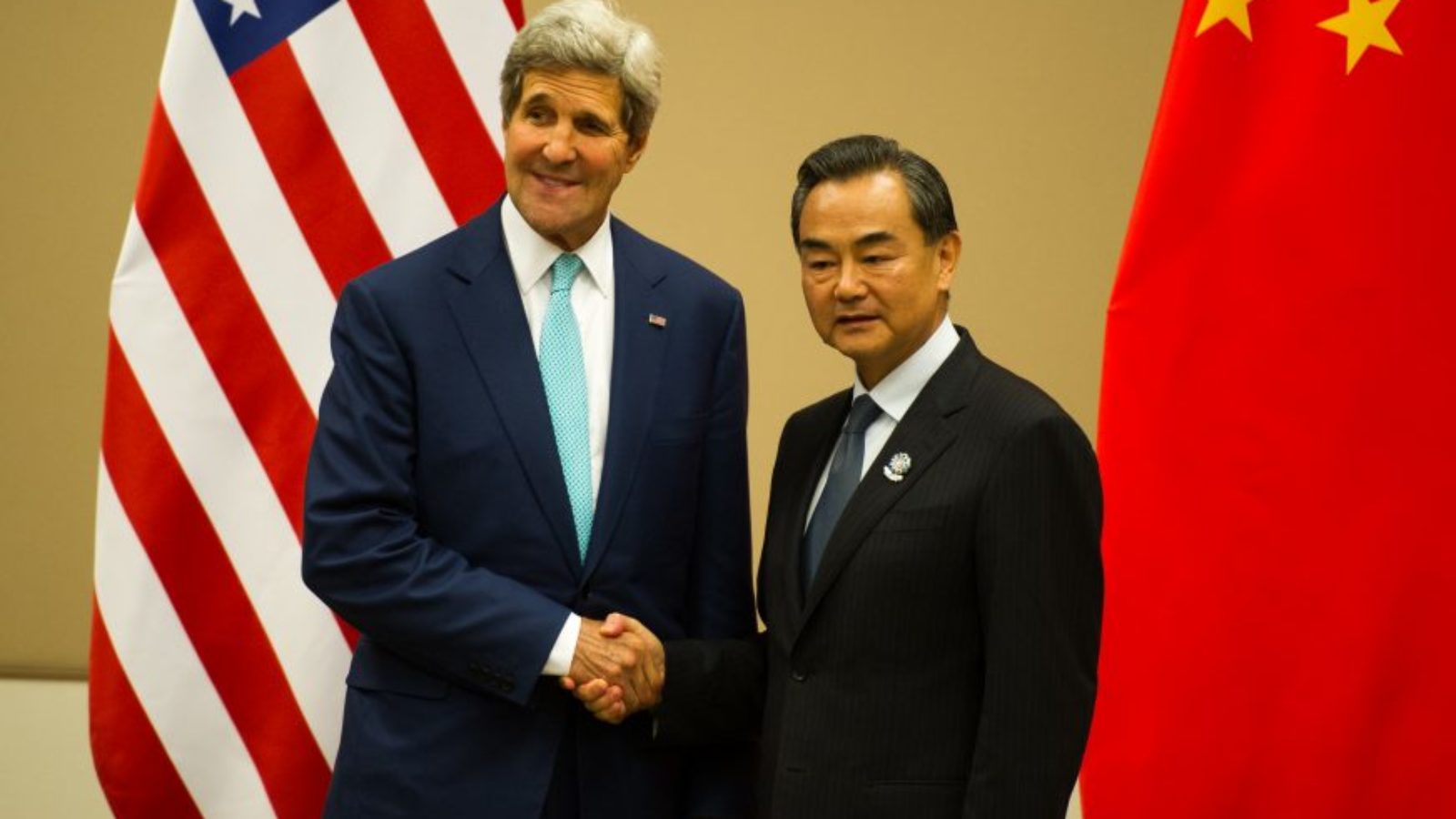 John Kerry and Wang Yi shaking hands