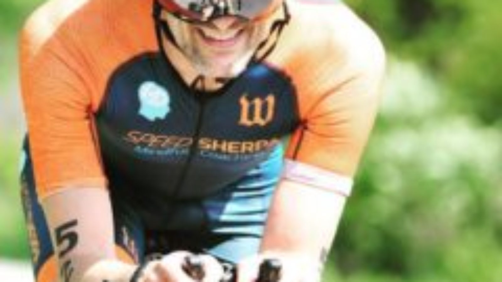 Faculty member David Edelstein riding bike