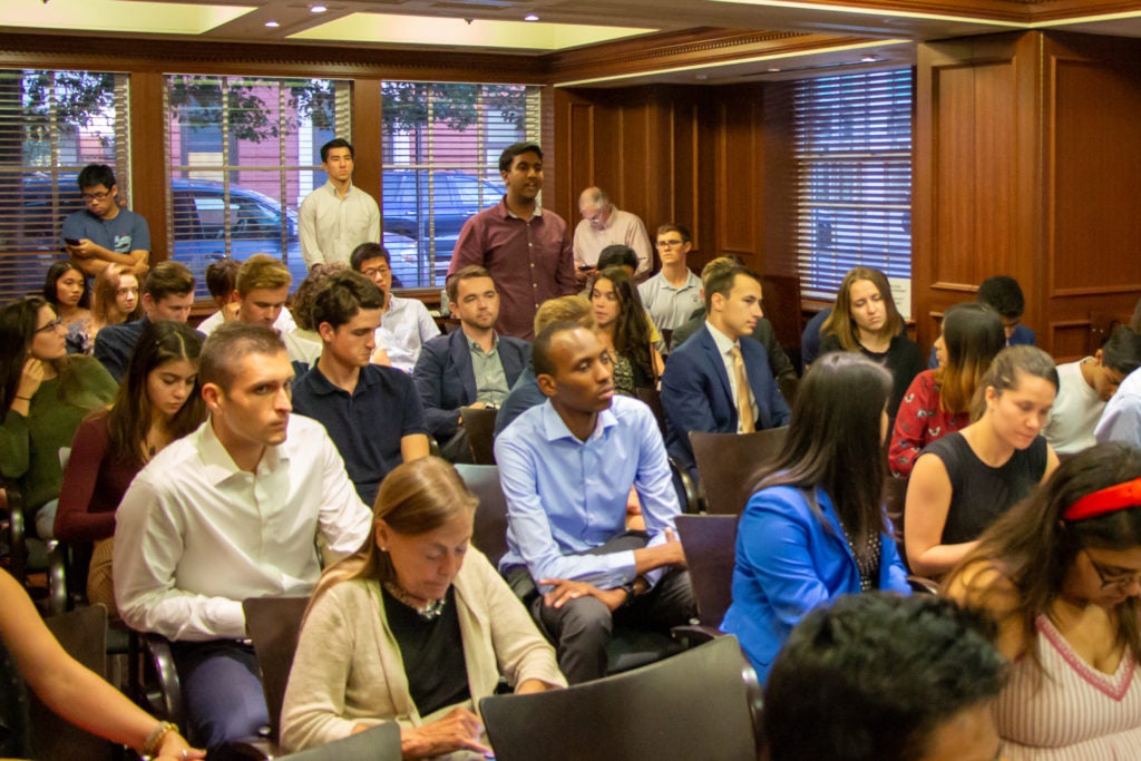 Student asks question at Centennial Fellows event.