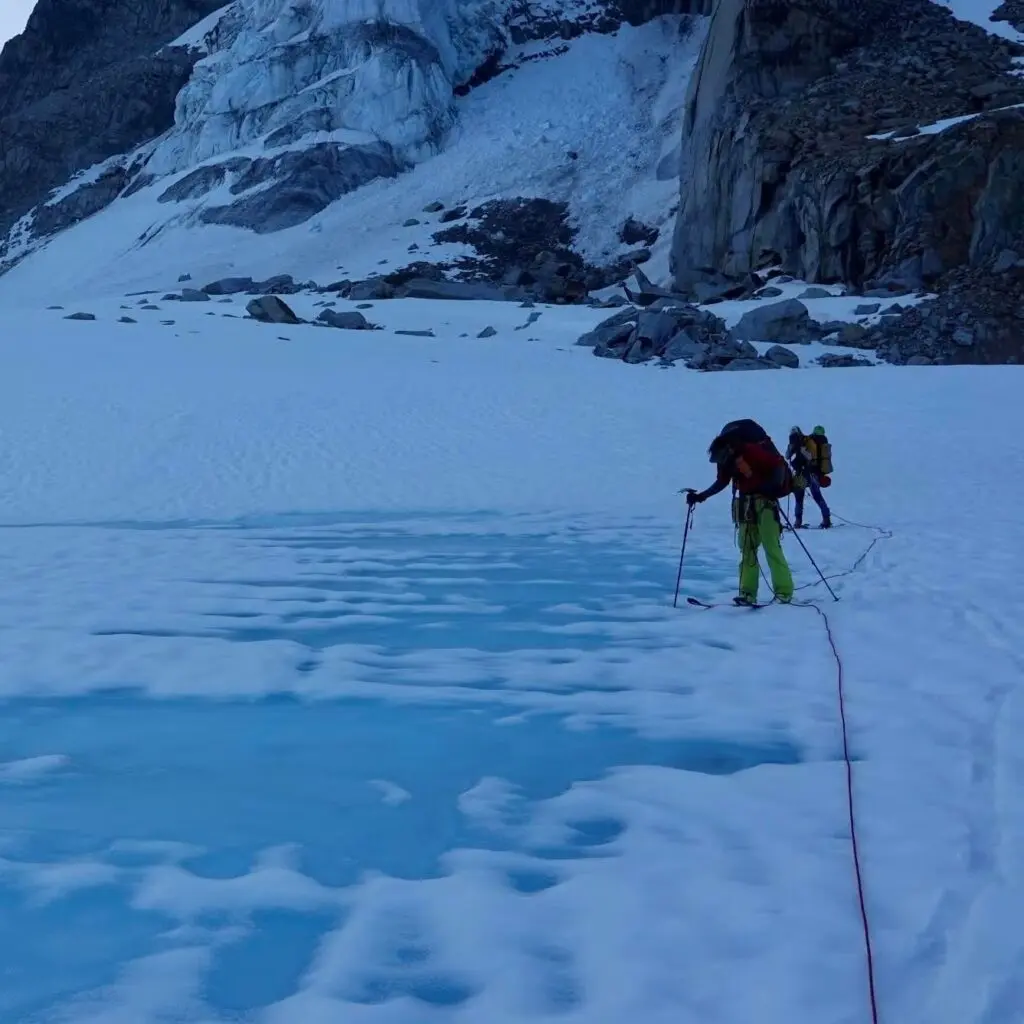 Matt Hickey standing on snowy and icy terrain in Alaska.