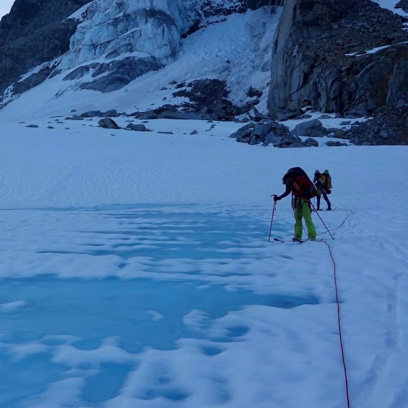 Matt Hickey standing on snowy and icy terrain in Alaska.