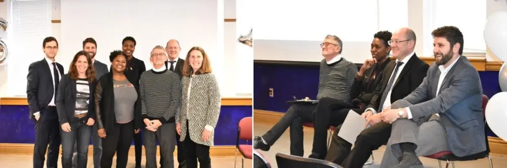Group of four men and four women who were guest speakers at Social Innovation Lab competition are photographed standing together in front of classroom.