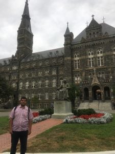 Ammar Nainar pictured outside Georgetown University's Healy Hall.