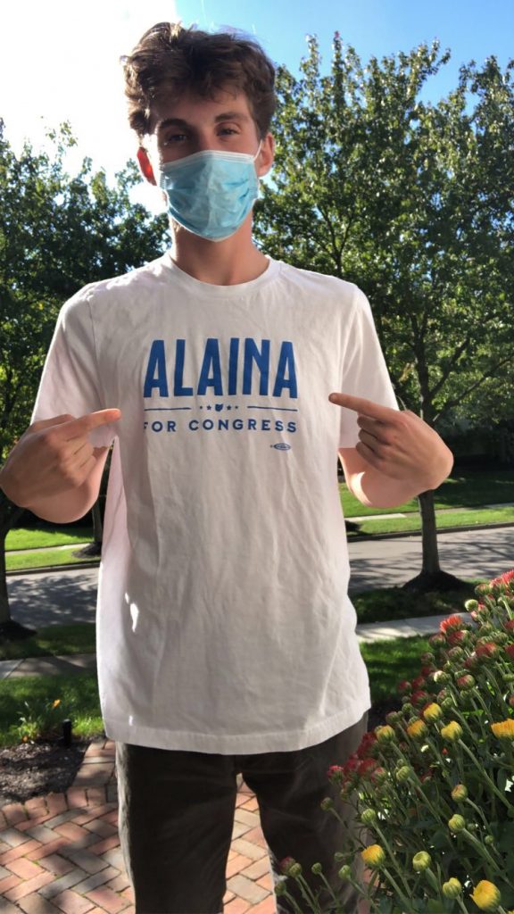 Sagbir pictured wearing a face mask and a "Alaina for Congress" T-shirt.