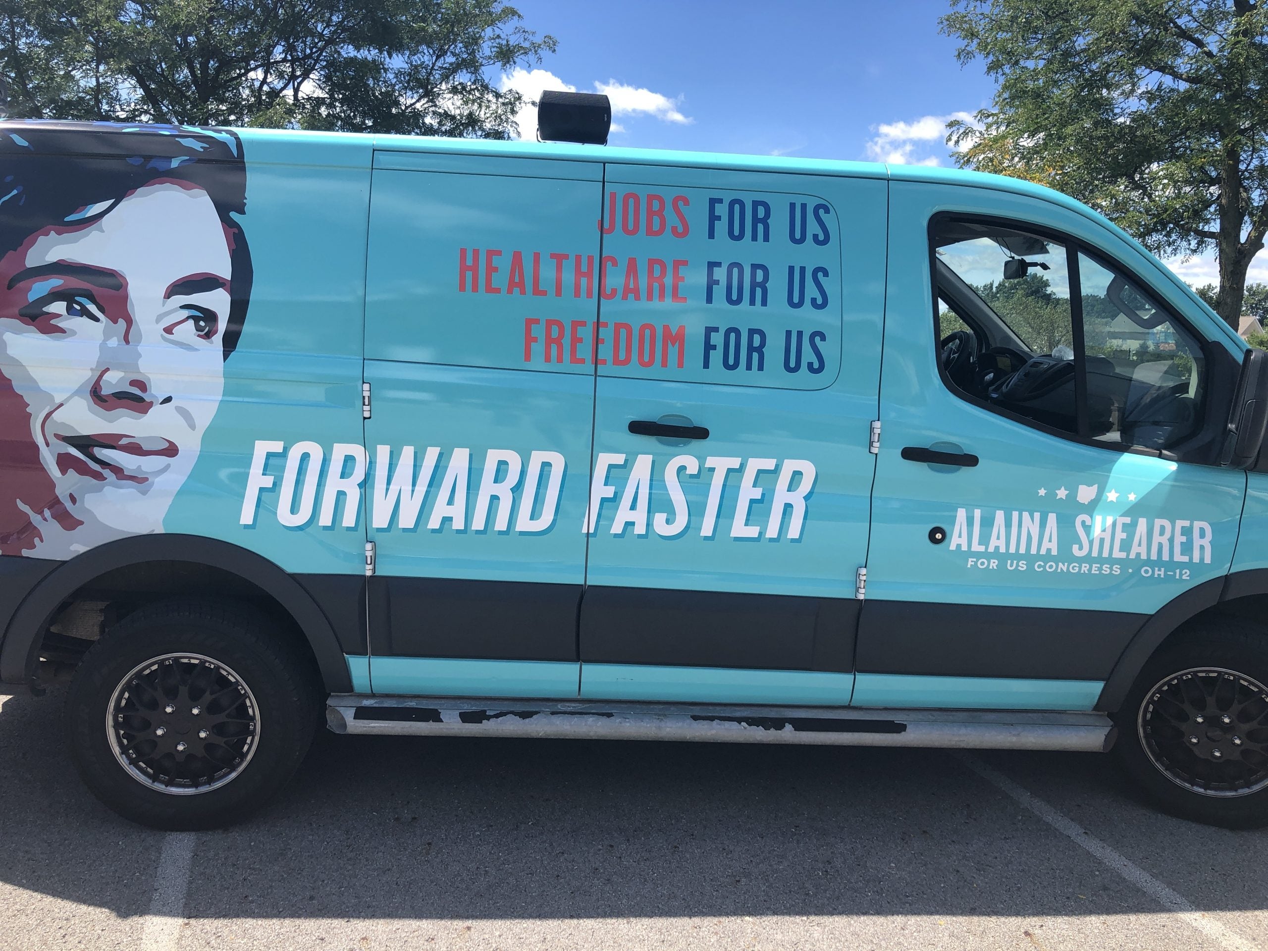 Shearer for Congress van imprinted with text: "Jobs for us. Healthcare for us. Freedom for us. Forward faster."