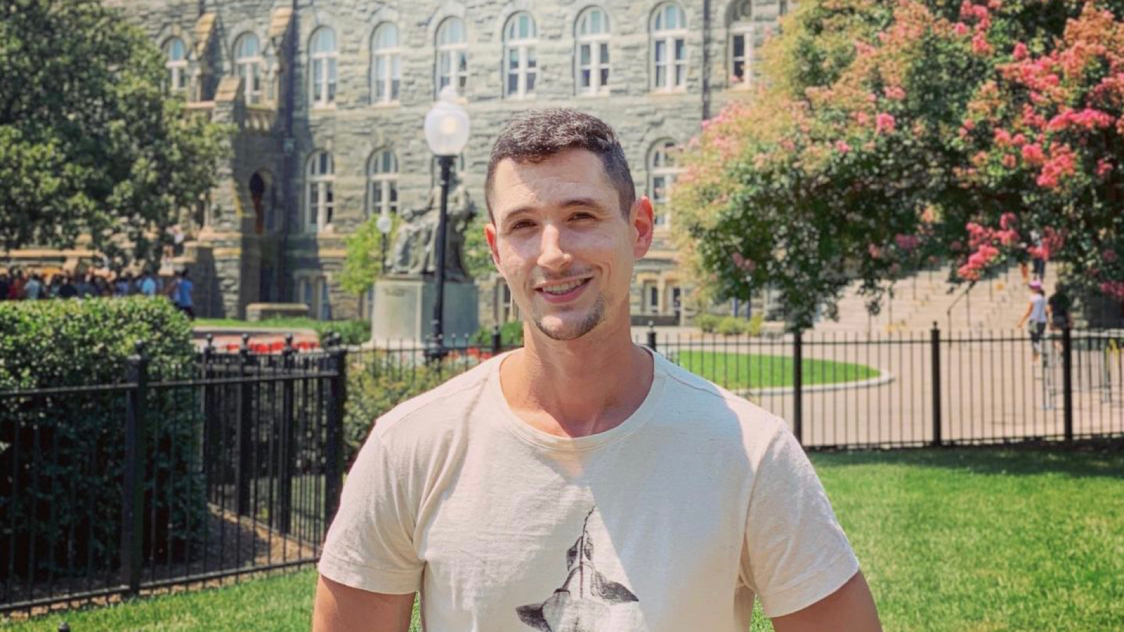 Ido Wulkan on campus in front of John Carroll statue.