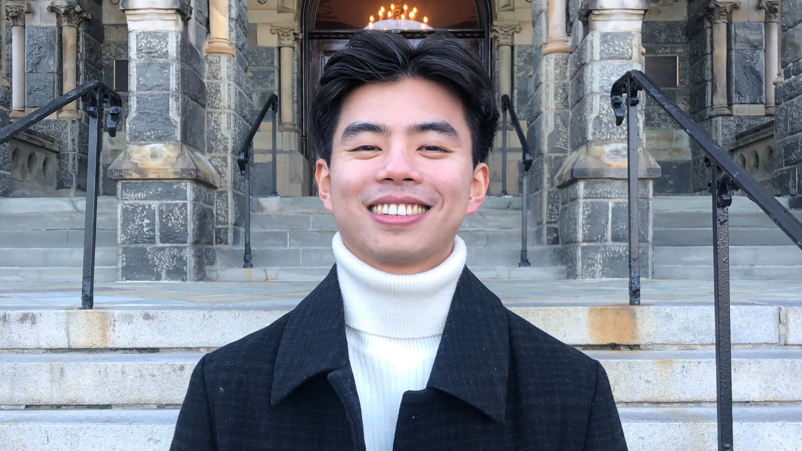 Shing Aung profile photo in front of Healy Hall steps