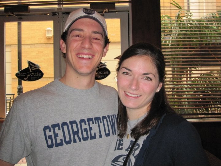 Kessler and his wife, Nicole, take a picture together as college students wearing Georgetown gear.