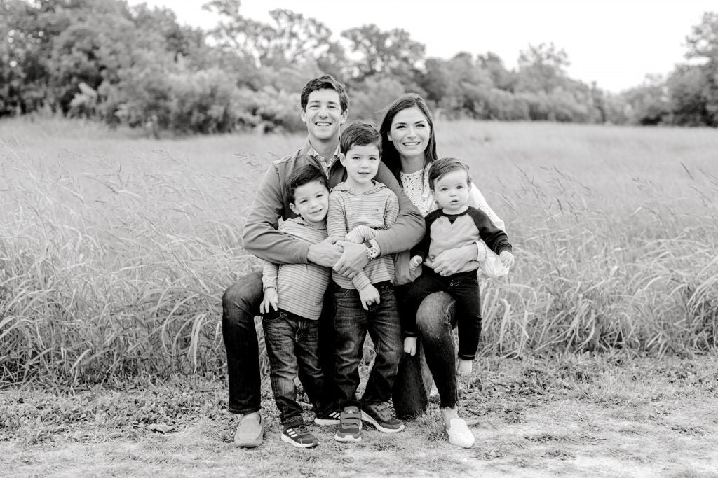 A black-and-white professional photo of the Kessler family.