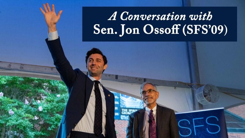 Ossoff waves to an audience in Georgetown&#039;s Red Square. Banner text reads: &quot;A Conversation with Sen. Jon Ossoff (SFS&#039;09)&quot;