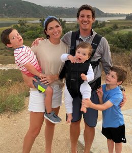 Craig Kessler and his wife pose for a photo on a hike with their three young sons.