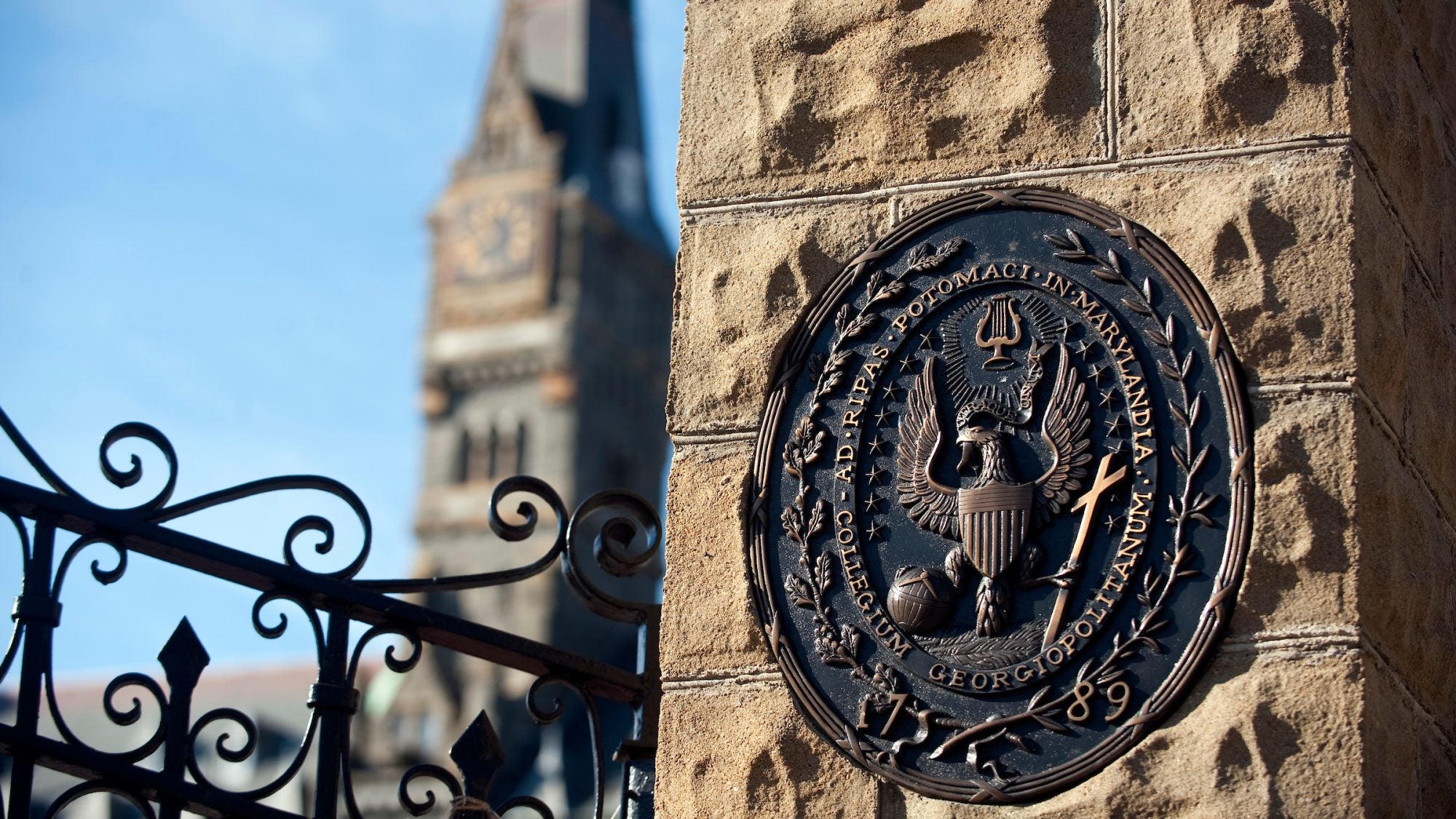 Georgetown seal, set in metal included on campus gates.