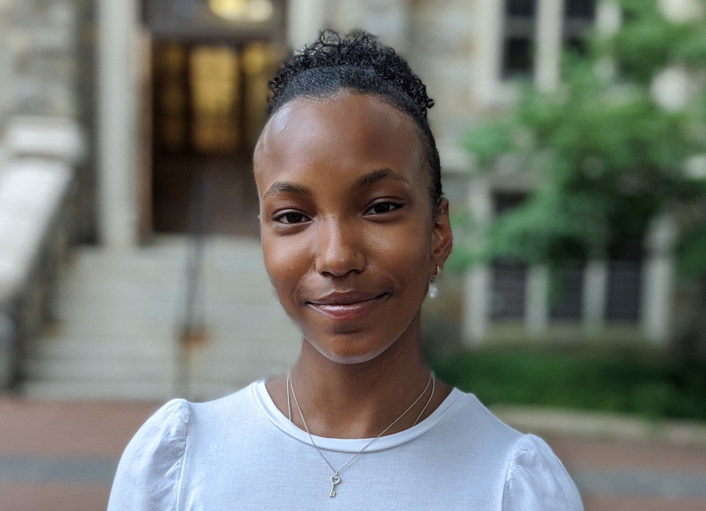 Aria Sommers profile shot in front of Georgetown's Copley Hall.