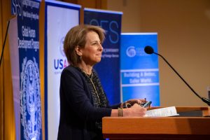 Liz Schrayer speaking behind a podium