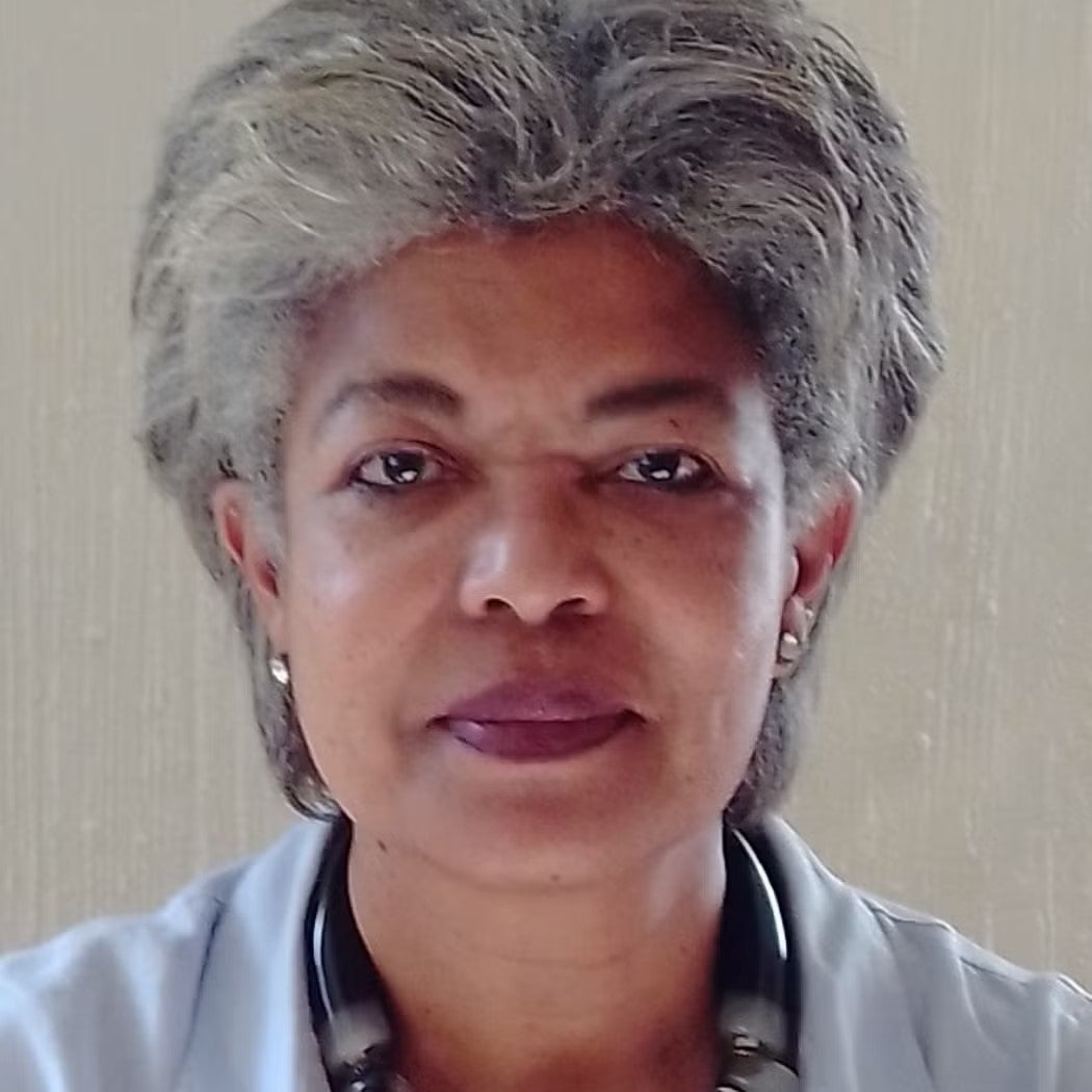 Headshot of Audrey Bracey Deegan in light blue top.