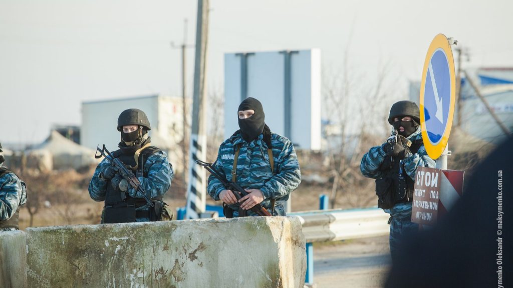 Russian soldiers start guard in a city street in Crimea