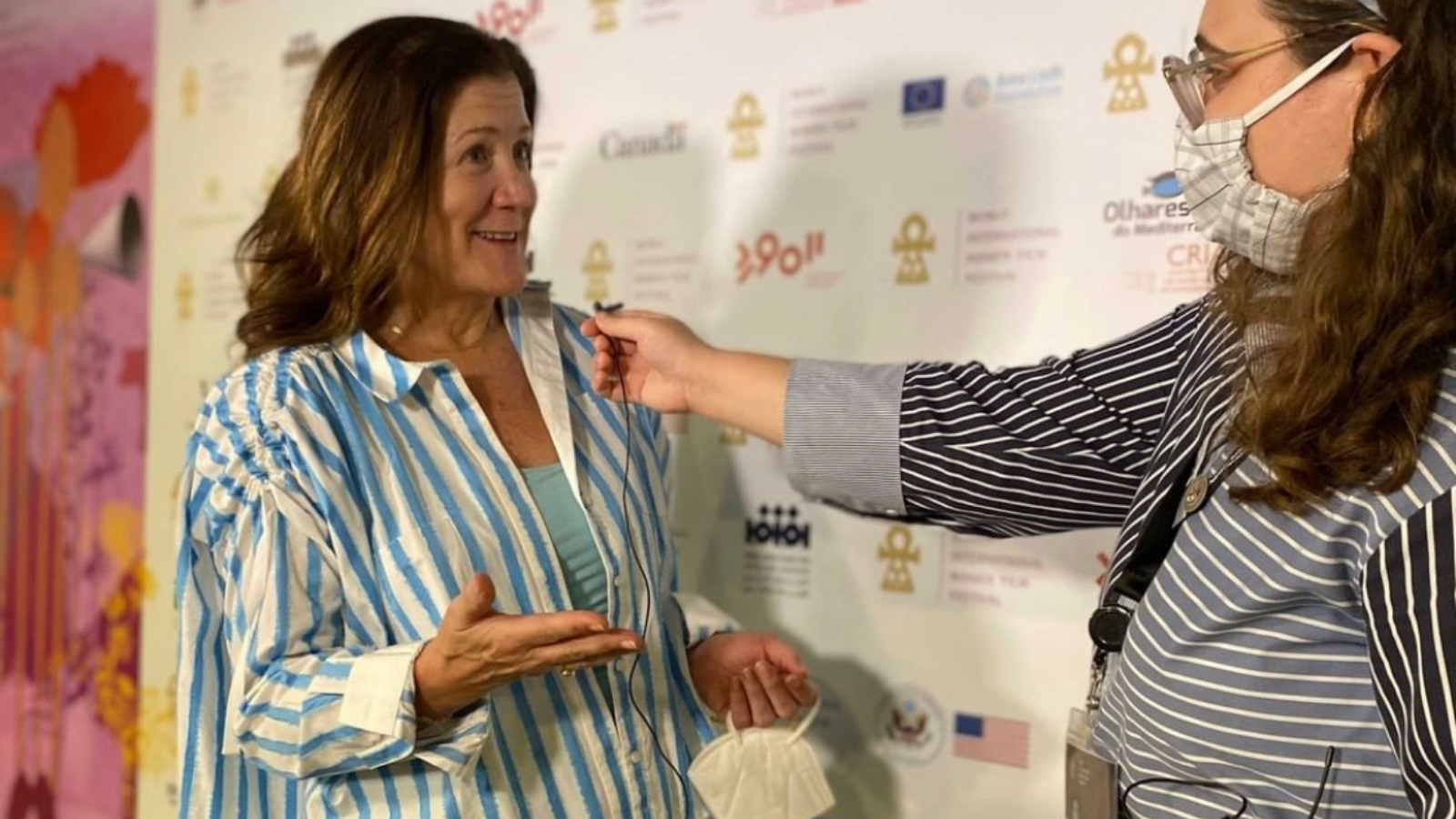 Photo of U.S. Ambassador to the Lebanese Republic Dorothy Shea (MSFS'91) giving an interview in front of an advertising step and repeat backdrop