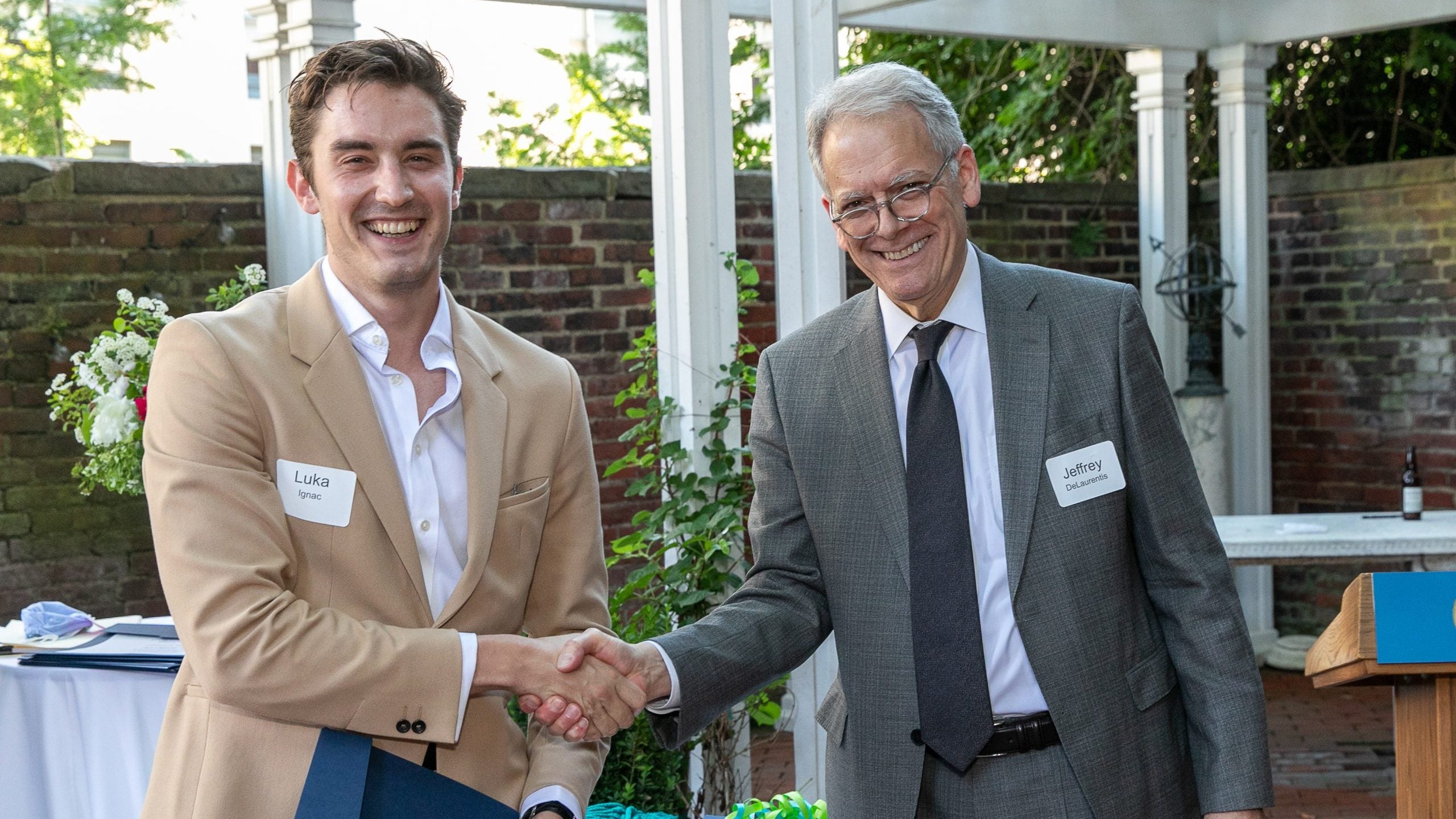 Luka Ignac shakes hands with Amb. DeLaurentis