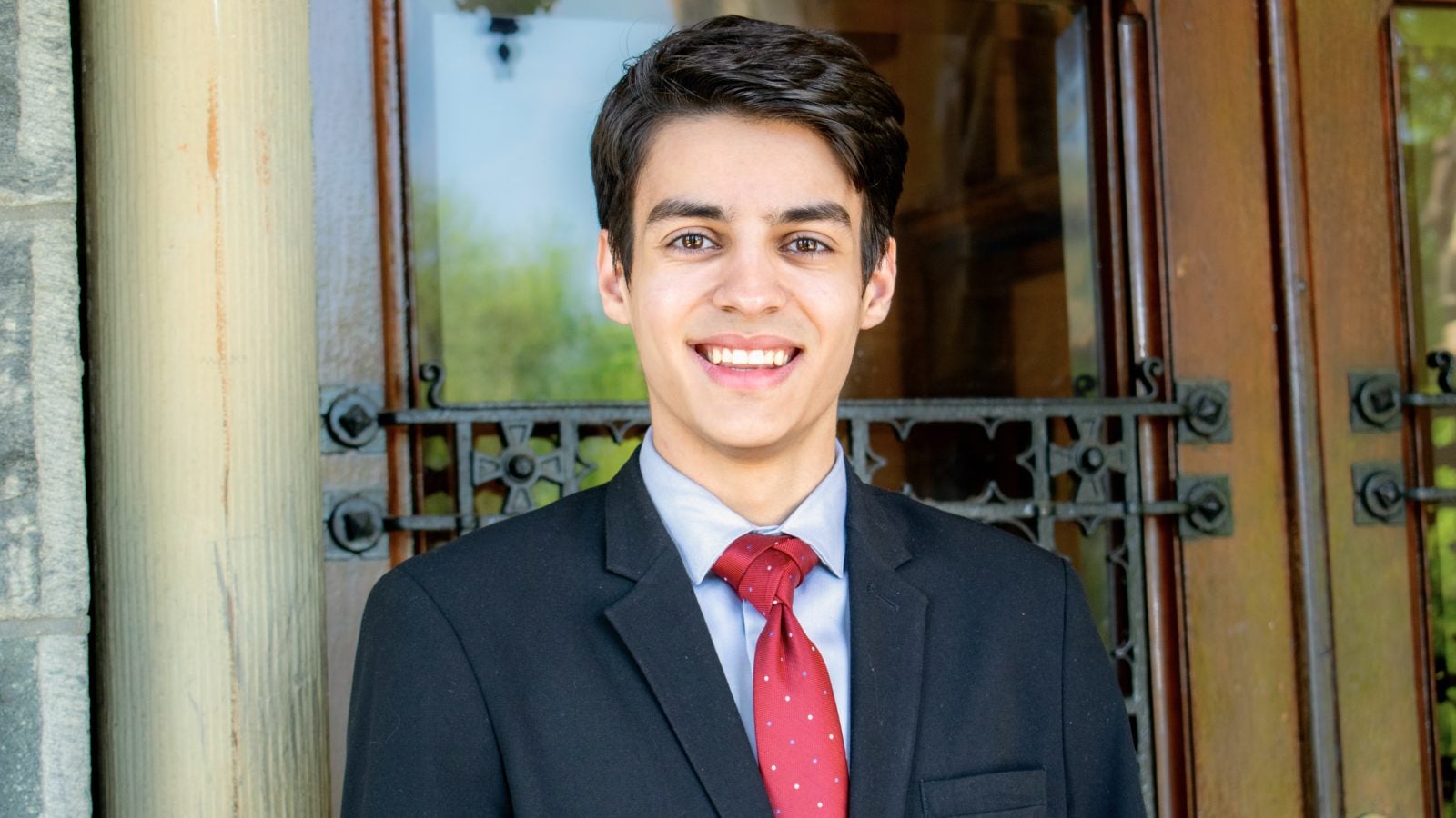 Lobo Koerich pictured shoulders up in business attire.