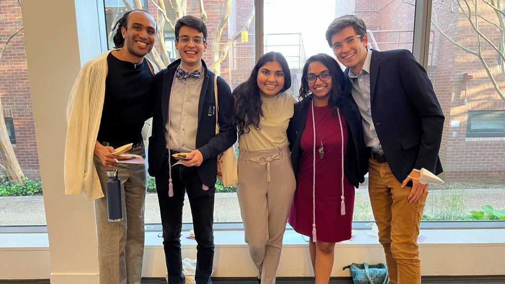 Students pose together in line at Lavender Graduation