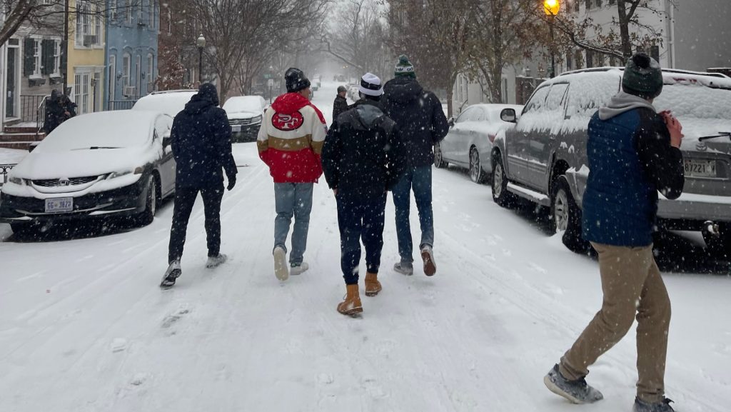 Students walking down O St in the snow