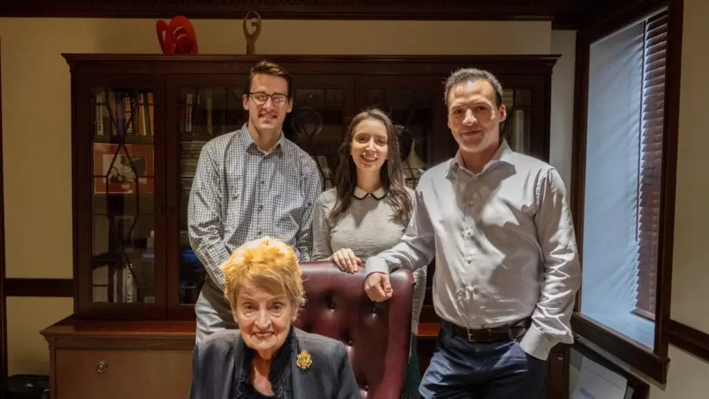 Teaching assistants standing with Secretary Albright.