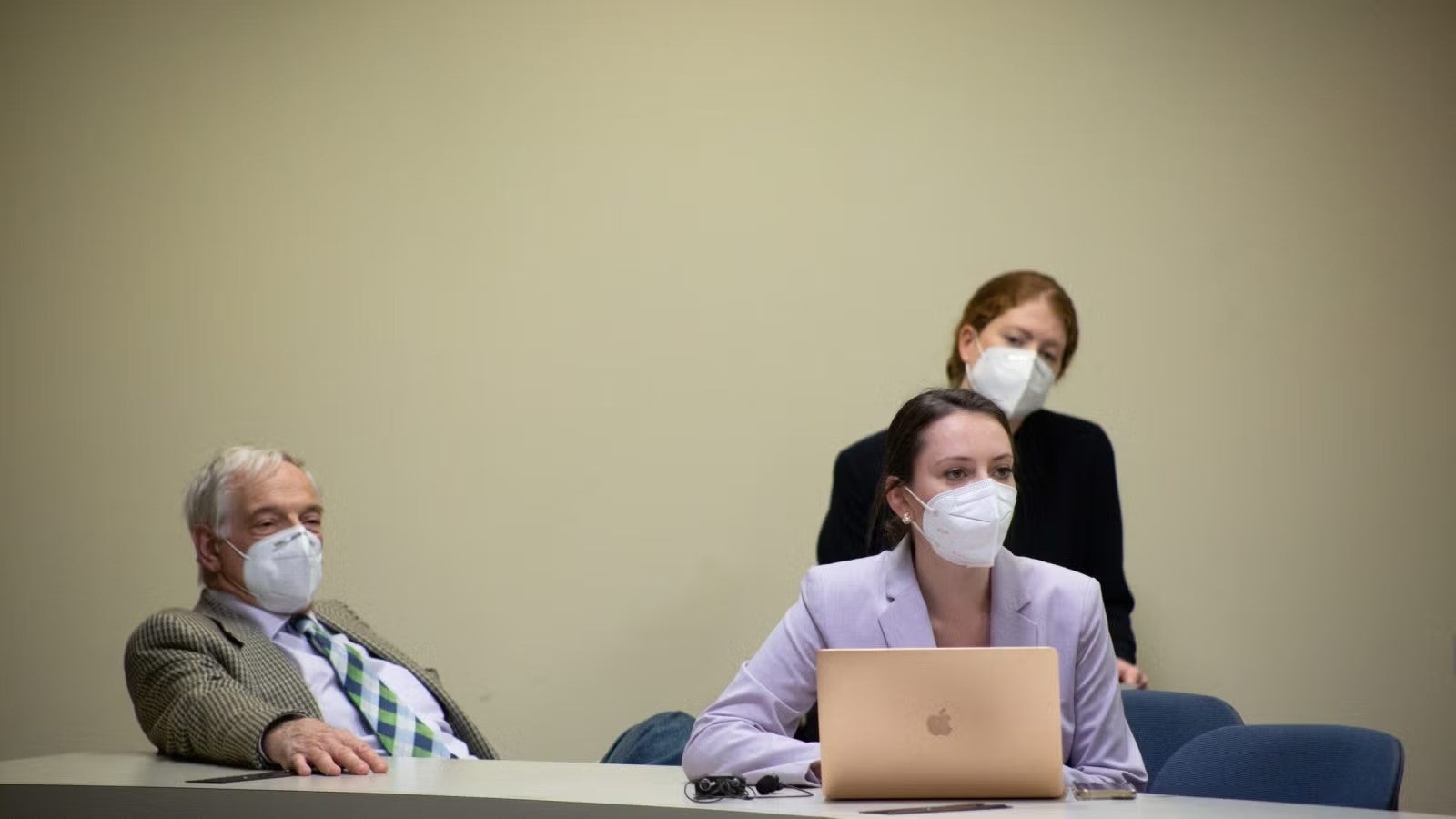 Vanessa sitting at table, working, during foreign policy crisis simulation.