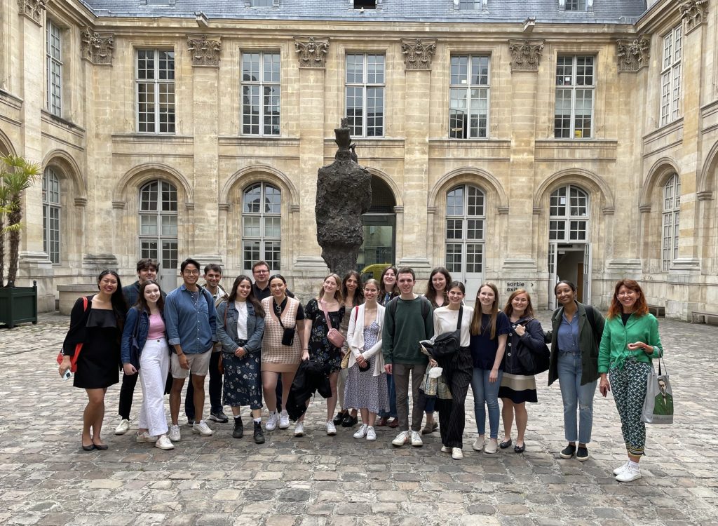 Students pose for a group photo outside the Museum of the Art and History of Judaism in the Marais district