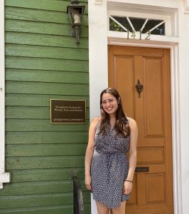 Marisa Morrison poses for a photo in front of the GIWPS townhouse in Georgetown