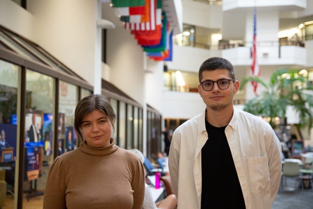 Iryna Adam (left) and Nikita Makarenko (right) stand in the ICC Galleria