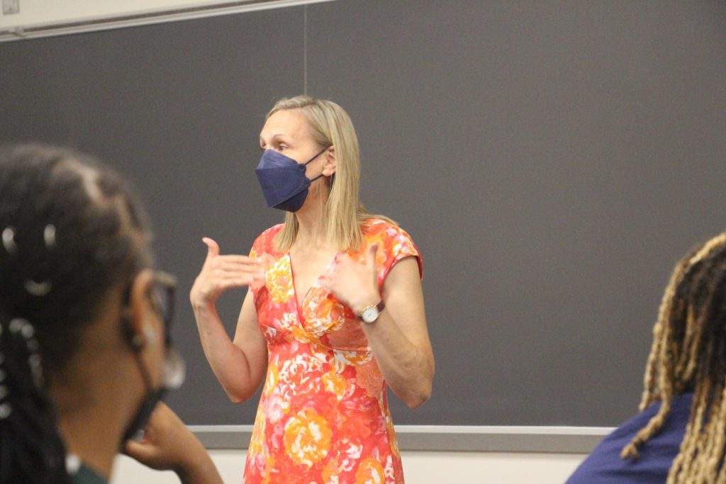 Elizabeth Stanley speaks to participants in a classroom