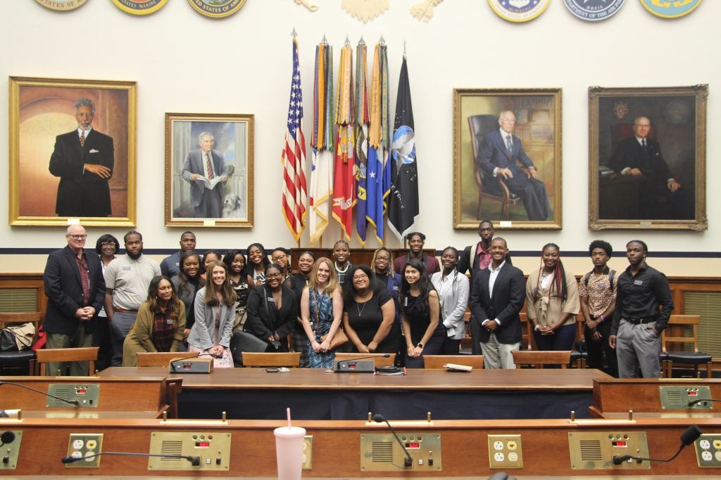 Program participants pose for a group photo on a visit to the U.S. House Armed Services Committee