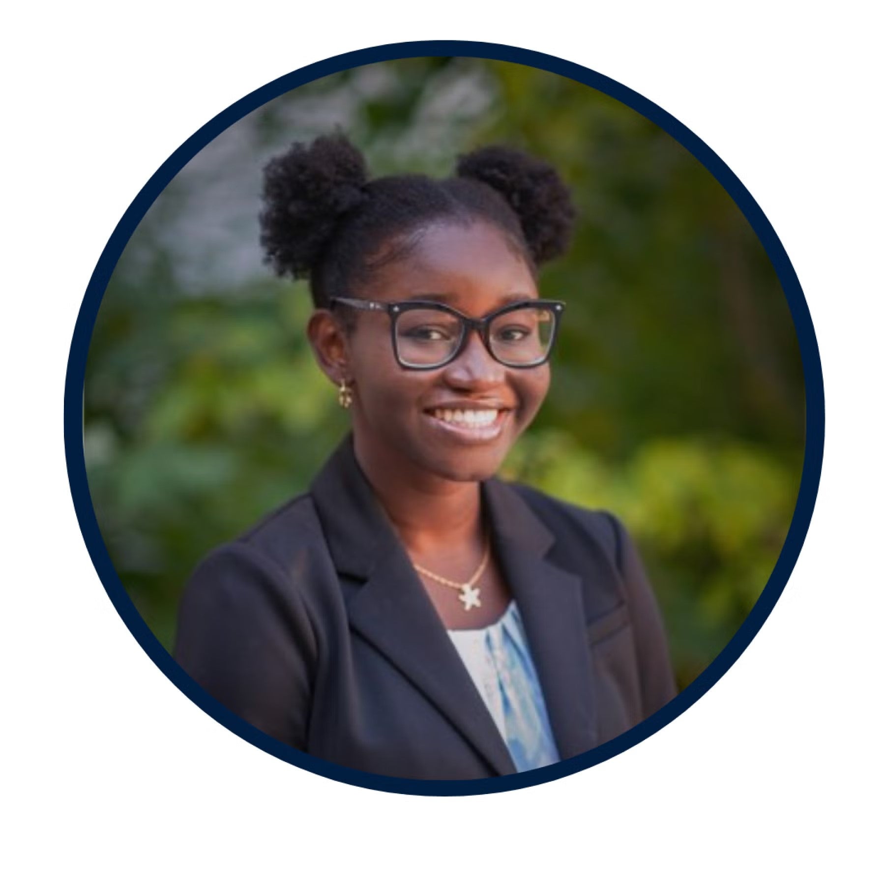 Soda Lo Headshot, wearing a navy blue blazer and white shirt.