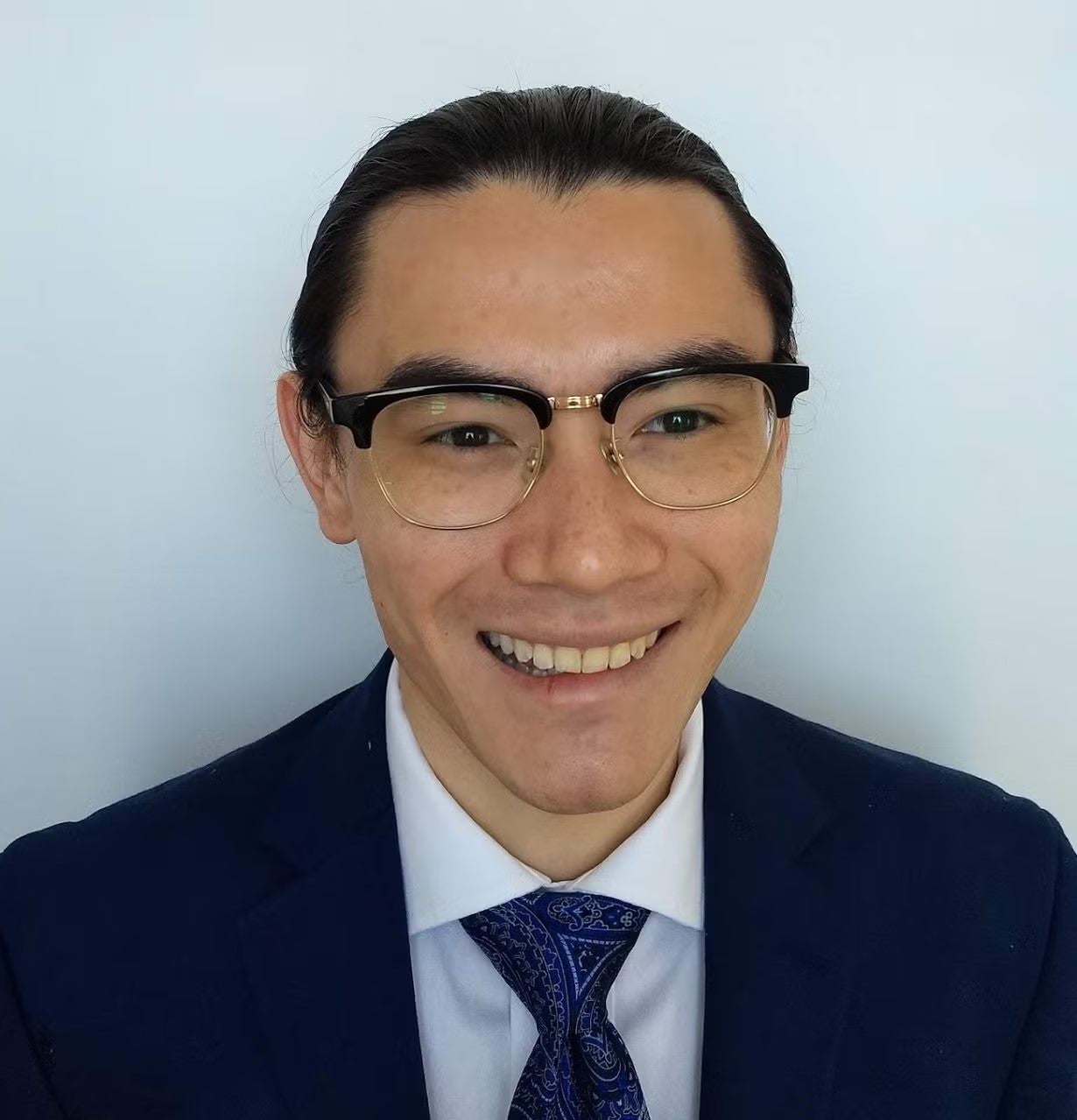Brendan Stewart Headshot, wearing a navy blue blazer, white shirt, and navy blue tie.