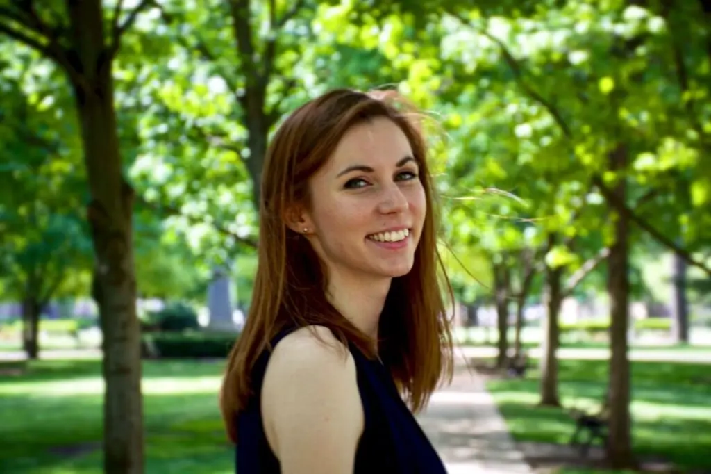 Therese McCarry Headshot, wearing a navy blue sleeveless top.