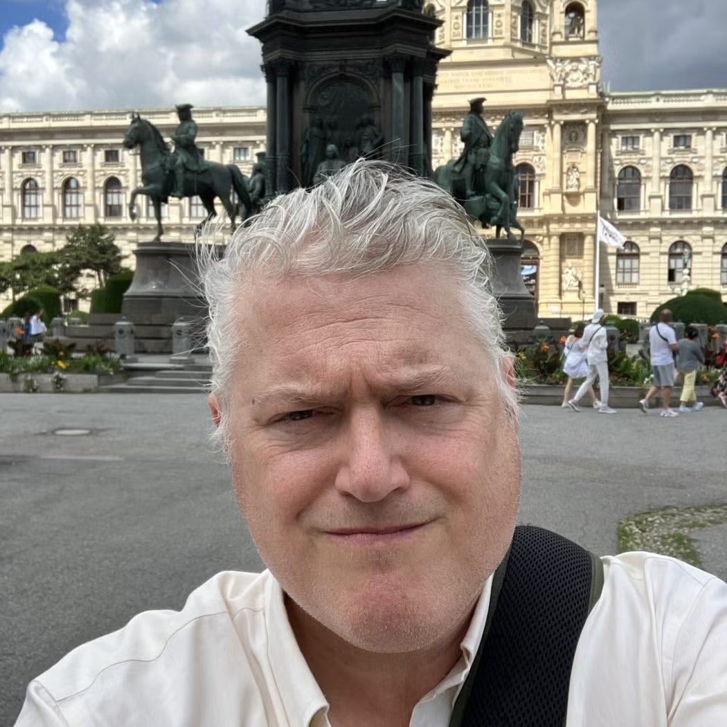 Jason Bruder Headshot wearing white button down shirt.