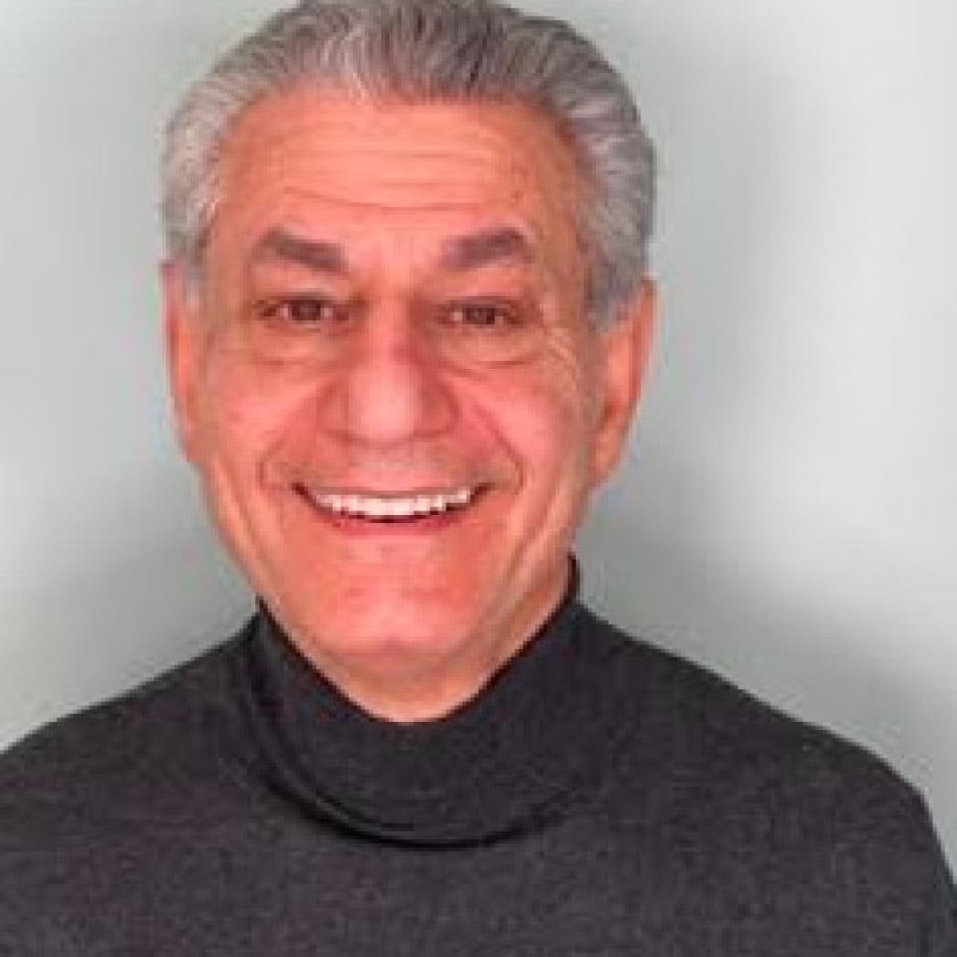 S. Rob Sobhani Headshot wearing a black turtleneck.