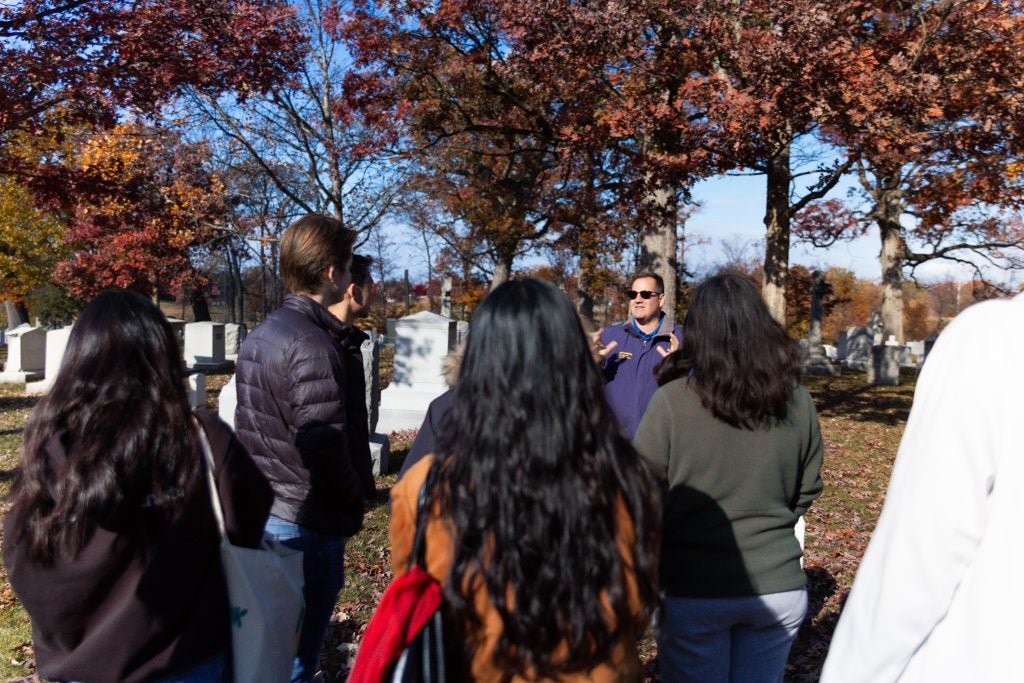 Historian Kevin Hymel gives a tour of Arlington National Cemetery to SFS students.