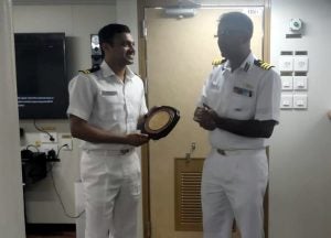 Saurabh Bhoyar (left) in his Indian Coast Guard uniform standing next to his captain.