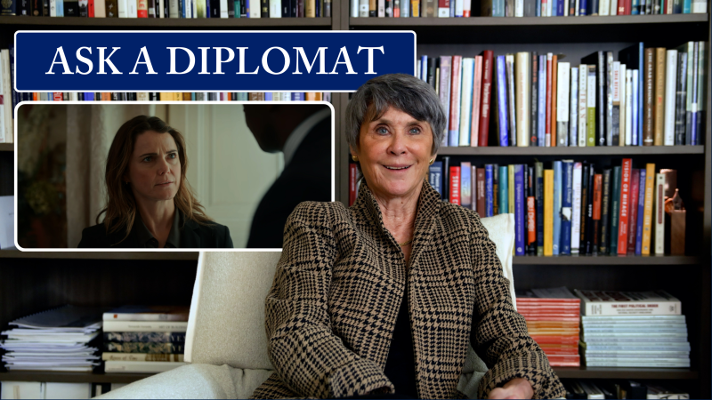 &quot;Ask a Diplomat.&quot; Ambassador Barbara Bodine in a library. Screen grab of a scene from The Diplomat featuring Kerri Russell&#039;s character, Kate.