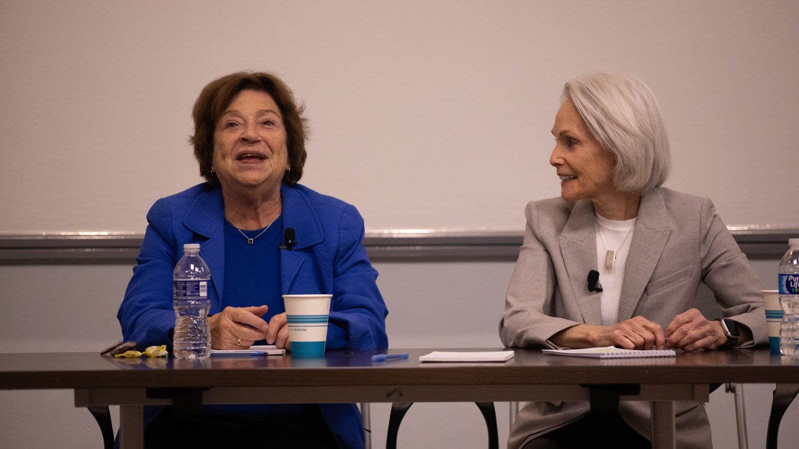 SFS Professor Emerita Angela Stent and Adjunct Professor Jill Dougherty sit at a table.